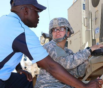 female soldier speaking to male