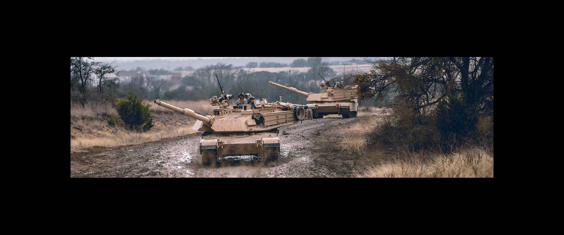 two Abrams M1A2 SEPv3 Main Battle Tanks