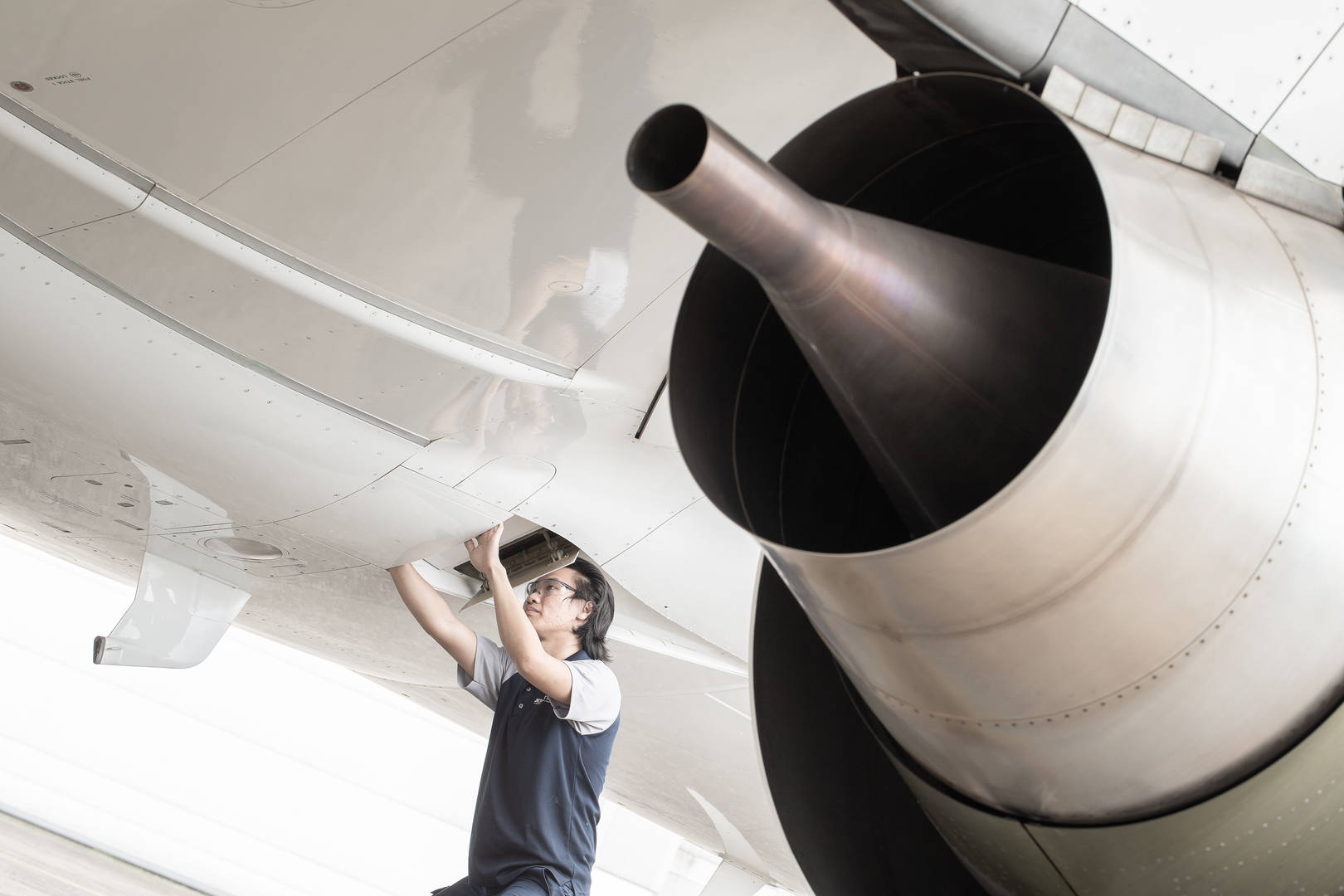 mechanic working on jet