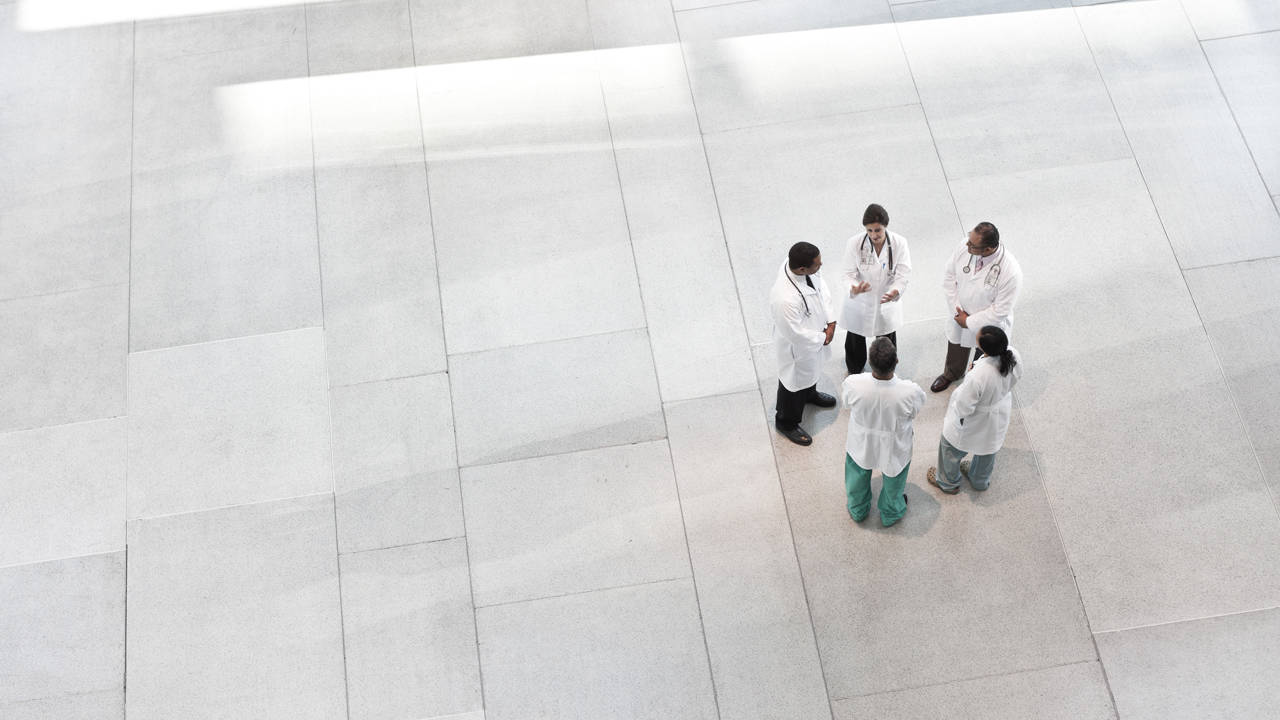 people gathered in lab coats