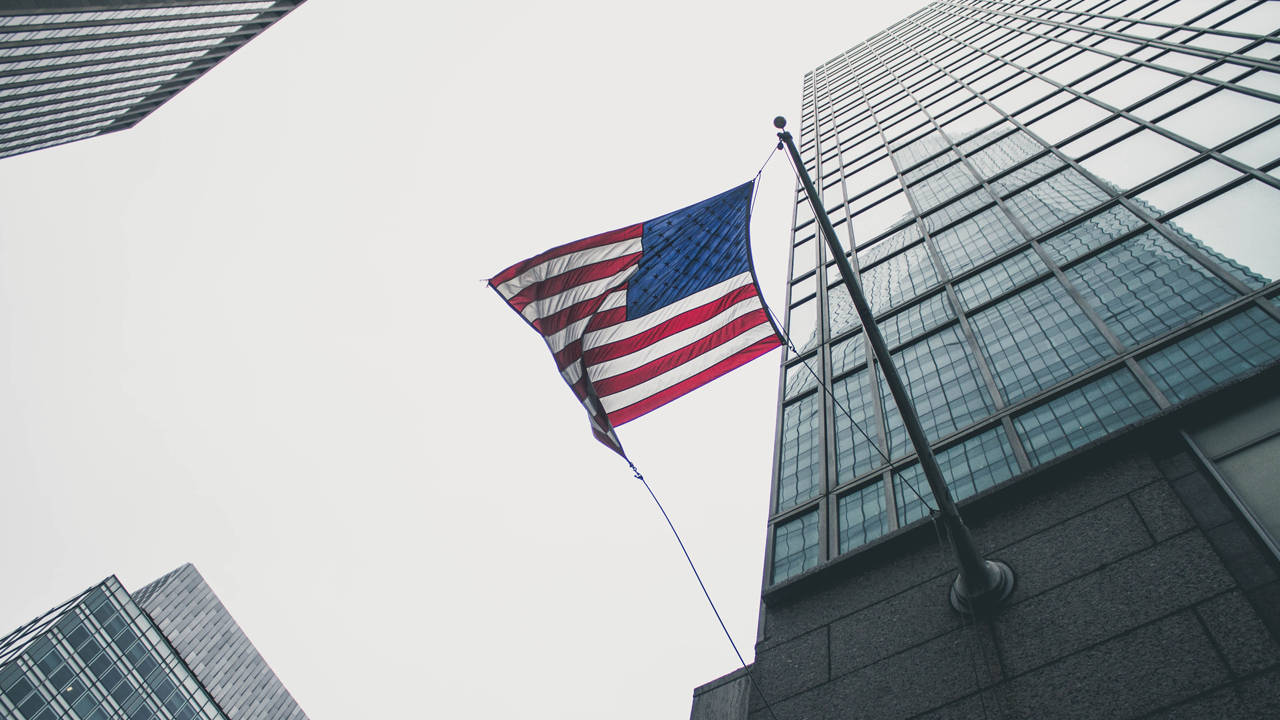 American flag hanging outside an office building